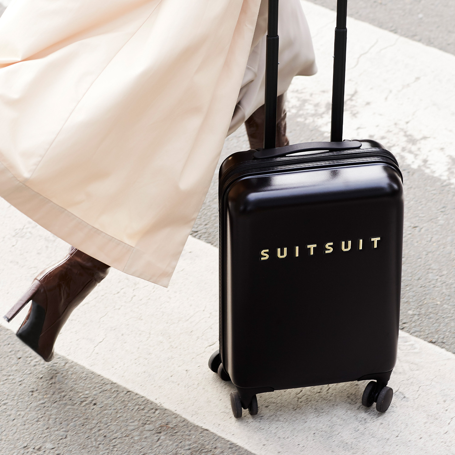 Black and gold carry top on luggage